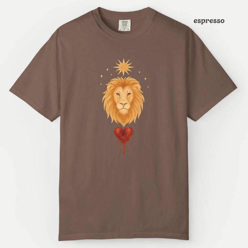 Comfort Colors Espresso t-shirt with a soft watercolor Leo lion design, golden sunburst, and a dripping red heart symbolizing the Leo zodiac sign.