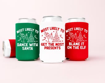May include: Three foam can coolers in green, white, and red. Each features a graphic of Santa in a martini glass and a Christmas tree. The green cooler says MOST LIKELY TO DANCE WITH SANTA, the white says GET THE MOST PRESENTS, and the red says BLAME IT ON THE ELF.
