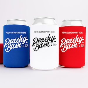 May include: Three beverage can coolers in blue, white, and red, each with the text "Peachy Bash ESTD 2023" in white script. The coolers are designed to fit around a standard can, with a fourth can lying on its side.