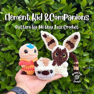 May include: Three crocheted plush figures titled Element Kid & Companions, Pattern by: No Way Jose Crochet. The set includes a peach-colored figure with a blue arrow, a small white and brown bison-like creature, and a winged lemur-like animal.
