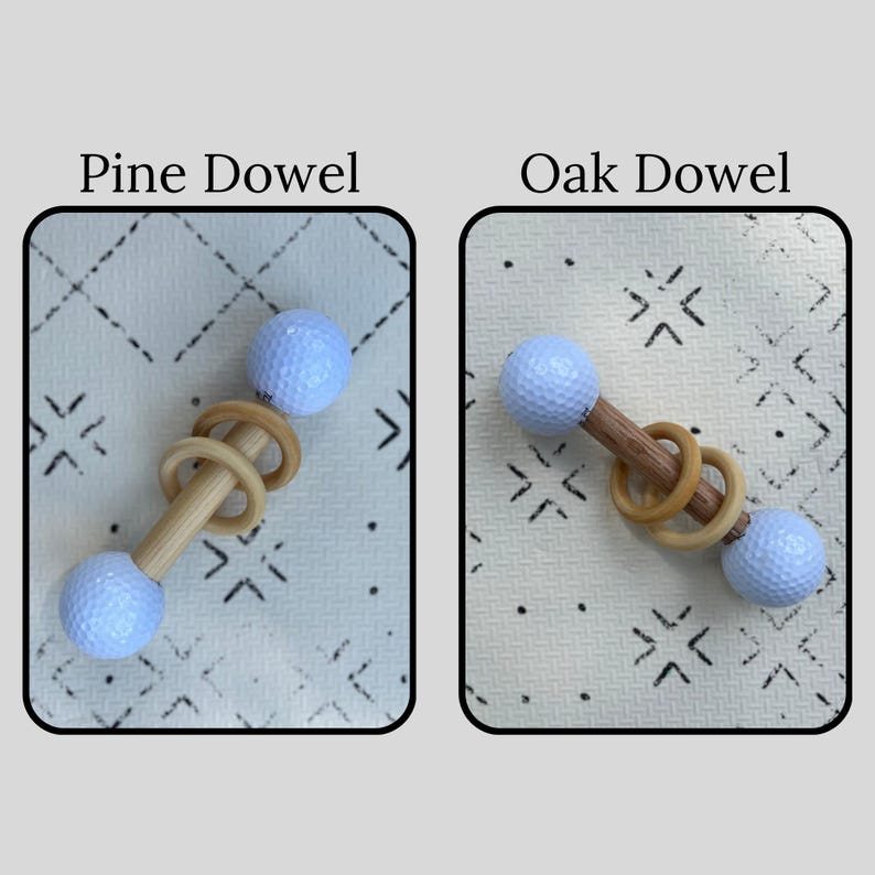 May include: Two baby rattles, each with a wooden dowel and two golf ball-shaped ends. One rattle has a pine dowel, the other an oak dowel. Both rattles have two wooden rings in the center. The text "Pine Dowel" and "Oak Dowel" are above each rattle.