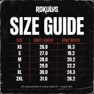 May include: A size guide chart with the brand name "ROKULUS" at the top. The chart displays sizes XS to 2XL, with body length and width measurements in inches. The text "All measurements in inches. Retail fit &mdash; true to size." is at the bottom.