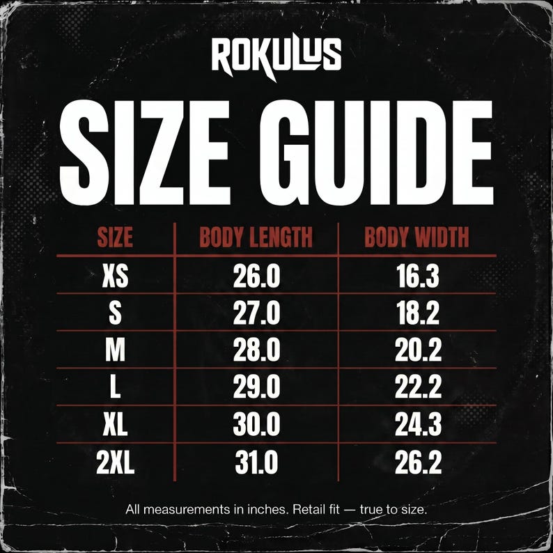 May include: A size guide chart with the brand name "ROKULUS" at the top. The chart displays sizes XS to 2XL, with body length and width measurements in inches. The text "All measurements in inches. Retail fit &mdash; true to size." is at the bottom.