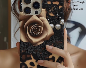 May include: A phone case featuring a large gold rose, black lace patterns, and leopard print accents. The case includes text that reads Magnetic Tough Cases For iphone Line. The design incorporates white pearl-like spheres on a black background.