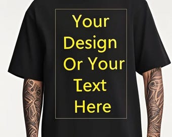 May include: Black t-shirt with a crew neck and short sleeves. The shirt features a rectangular design in the center with the text "Your Design Or Your Text Here" in yellow. The shirt is plain and simple, suitable for customization.