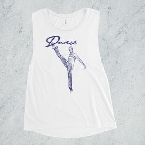 May include: White sleeveless muscle tank top with a blue graphic of a dancer in a leg extension pose. The graphic includes the word "Dance" in a stylized font.