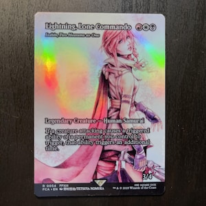 May include: A holographic trading card featuring Lightning, Lone Commando, a Legendary Creature Human Samurai. The card has a pink and white color scheme with a detailed illustration of a character. Text includes the card's name, abilities, and artist.