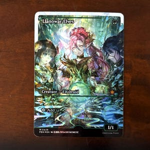 May include: A fantasy art card featuring three elves with long hair and floral accents. The card reads "Llanowar Elves" and "Creature - Elf Druid". The artwork is detailed with a green and blue color scheme, and the card is marked 1/1.