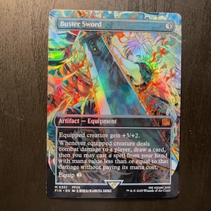 May include: A Magic: The Gathering card titled "Buster Sword." The card features a vibrant illustration of a character wielding a large sword. The card is an Artifact - Equipment, with text describing its abilities. The card has a holographic, iridescent finish.