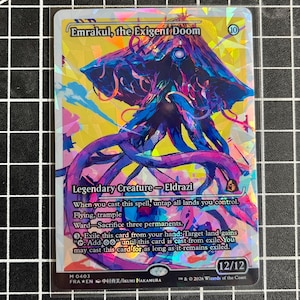 May include: A holographic trading card titled Emrakul, the Exigent Doom, featuring a colorful, abstract illustration of a multi-tentacled creature. The card displays text including Legendary Creature, Eldrazi, and power/toughness stats of 12/12.