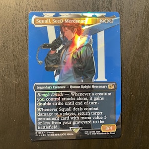 May include: A Magic: The Gathering card featuring Squall, SeeD Mercenary. The card has a blue background with a character illustration. The card text includes "Legendary Creature - Human Knight Mercenary" and "Rough Divide". The card has a 3/4 power and toughness.