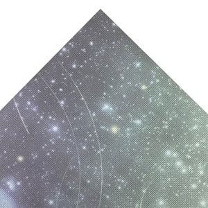 May include: A close-up of a grey and white fabric with a pattern of small white dots and a subtle shimmer. The fabric has a textured surface and a slightly iridescent sheen.