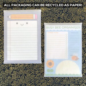 May include: Two notepad sets with a cute design. The first notepad has a pencil and a smiley face. The second notepad has a bee and a sunflower. Both notepads have the text "Busy Bee Organiser" and "Things to do" and "Reminders".