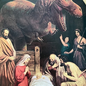 El Nacimiento de Cristo, un original collage artístico cortado a mano que presenta el nacimiento de Jesucristo en un pesebre vigilado por un Tyrannosaurus rex.