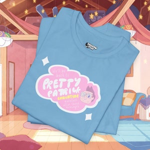 May include: Light blue t-shirt with a pink and white graphic of a cartoon character with the text "We'll be back to Pretty Patrick" and "Longcatine marathon after these messages".