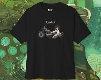 May include: Black t-shirt with a graphic of a character riding a motorcycle. The text "キノの旅" and "Ride a Journey" are printed on the shirt.