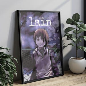 May include: A black framed poster with a purple and blue background featuring a young girl with brown hair and a white hoodie. The text "serial experiments lain" is at the top of the poster.