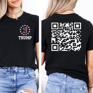 May include: Black t-shirt with a white circle containing the American flag and the numbers 45 and 47. The text "TRUMP" is below the circle. The back of the shirt has a black and white QR code.
