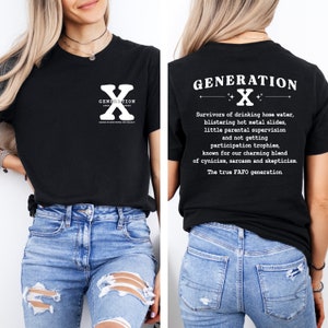 May include: Black t-shirt with white text and graphics. The front features "GENERATION X" and the back lists defining characteristics of the generation. The shirt is worn with blue jeans.