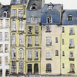 May include: Watercolor painting of Parisian buildings with yellow, blue, and gray facades. The buildings have multiple windows, balconies, and dormers. The bottom of the buildings have shops and cafes. The artist's signature is in the bottom left corner.