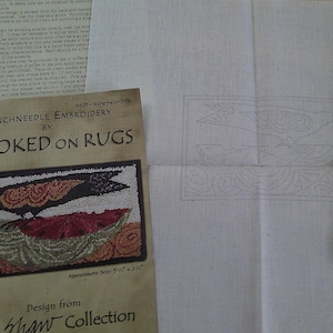 May include: A punchneedle embroidery kit by Hooked on Rugs, featuring a design of a crow on a watermelon. The kit includes a printed pattern, fabric, and embroidery floss. The approximate size of the finished piece is 5 1/2" x 3 1/2".