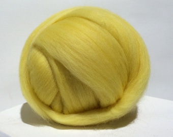 May include: A ball of bright yellow wool roving, perfect for felting or spinning.