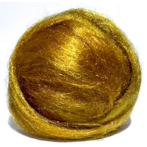 May include: A ball of gold metallic fiberfill. The fiberfill is soft and fluffy, and it has a shimmery finish.