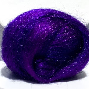 May include: A ball of purple sparkly fiber, perfect for crafting projects.