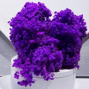 May include: A handmade wooden sign with the text "Welcome" in a playful font. The sign is painted white with a distressed finish, and features a decorative floral design in shades of pink and green. It measures approximately 12 inches wide.