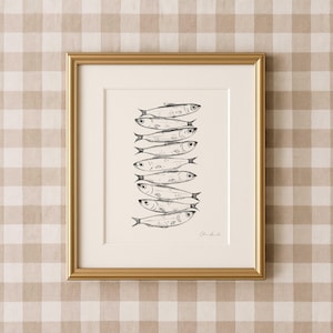 Nine whimsical sardines in a vertical line, each swimming in a different direction, line drawing print with moody, storybook, cottagecore style. Kitchen Decor Sardine print.