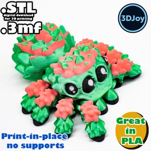 Peut inclure: Une araign&eacute;e imprim&eacute;e en 3D de couleur verte et rose avec de grands yeux. L'araign&eacute;e est imprim&eacute;e en place et ne n&eacute;cessite pas de supports. Le texte "STL digital download for 3D printing .3mf" et "3DJoy" sont visibles sur l'image. Le texte "Print-in-place no supports" et "Great in PLA" sont &eacute;galement visibles sur l'image.