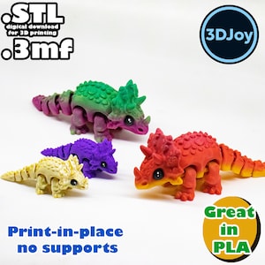 May include: Four 3D printed dinosaur models in different colors: green, purple, yellow, and red. The dinosaurs are articulated and can be posed in different ways. The text "Print-in-place no supports" and "Great in PLA" is visible in the image.