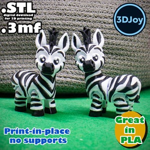 May include: Two 3D-printed zebra figurines with black and white stripes, standing on a green surface. The figurines have large eyes and small black manes. Text on the image includes "STL," ".3mf," "Print-in-place no supports," and "Great in PLA."