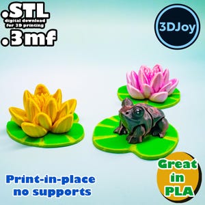 May include: A 3D-printed frog figurine, a yellow lotus flower, and a pink lotus flower, each on a green lily pad. The image includes the text "STL digital download for 3D printing .3mf" and "Print-in-place no supports". The text "Great in PLA" is also present.