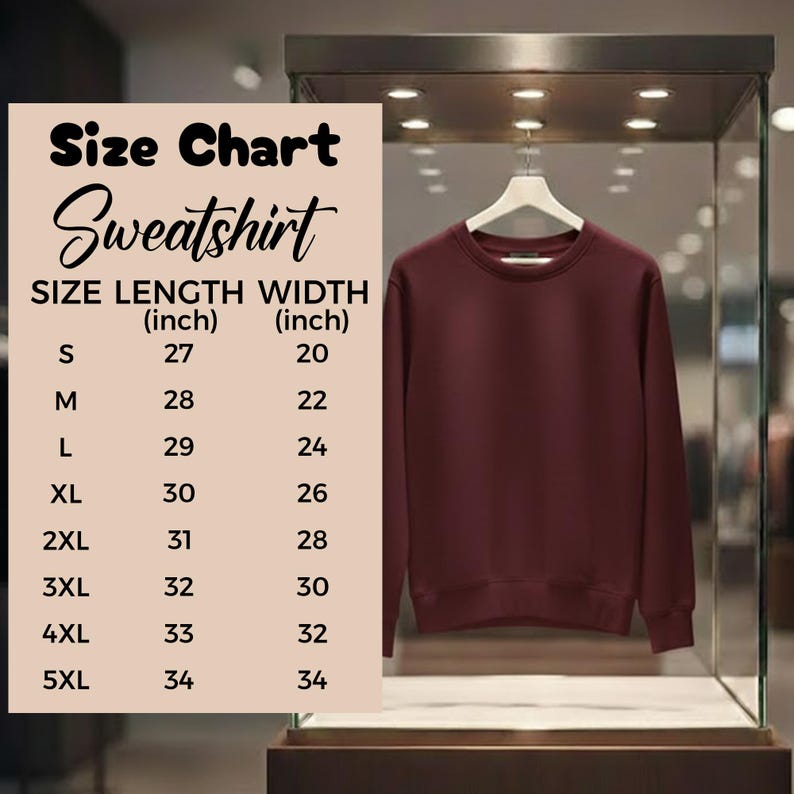 May include: A maroon sweatshirt hangs on a white hanger inside a glass display case. A size chart is displayed to the left, detailing length and width measurements in inches for sizes S through 5XL.