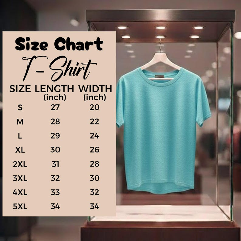 May include: A light blue T-shirt displayed on a hanger inside a glass case. A size chart is visible, detailing shirt sizes from S to 5XL, with length and width measurements in inches. The shirt has a crew neck and short sleeves.