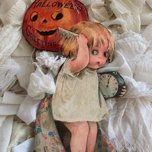 May include: Vintage Halloween greeting card featuring a girl holding a clock and a pumpkin with the text "Halloween Greeting".