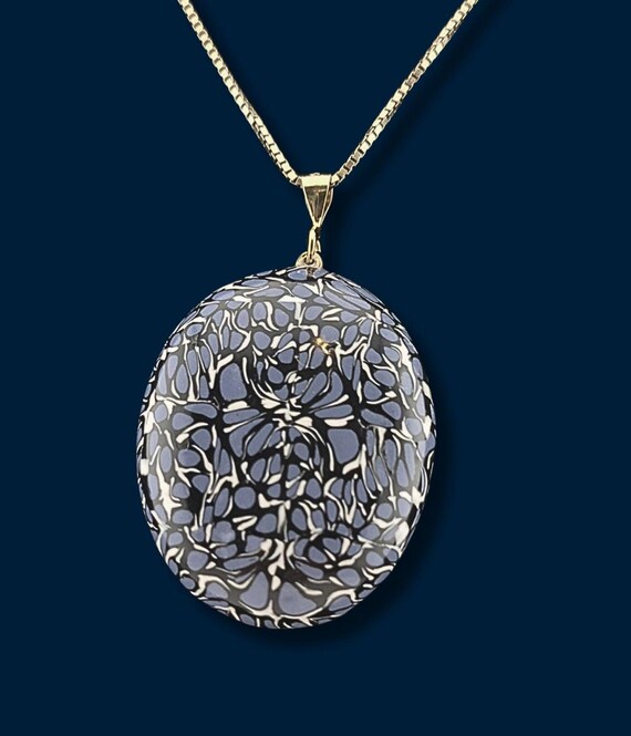 Abstract blue, white, black oval pendant necklace