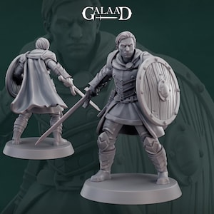 May include: A gray plastic miniature figurine of a person wearing armor and holding a sword and shield. The figurine is standing on a round base.