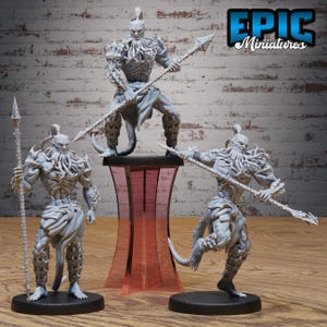 May include: Three grey unpainted fantasy warrior miniatures with tentacle-like facial features, muscular builds, and tails. Each figure holds a long spear-like weapon. The figures stand on circular black bases, with one elevated on a red stand.