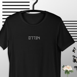 07734!!! Or, Hello! From the upside down world of 7-digit ambigrams!!! Another fantastic Black t-shirt with white embroidery!!! What a find!