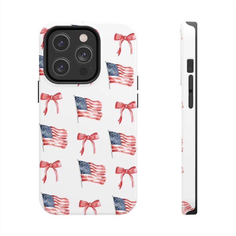 May include: White phone case with a pattern of red, white, and blue American flags and red bows.
