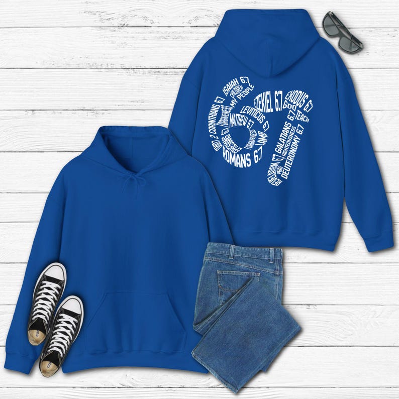 May include: Two blue hooded sweatshirts with a white graphic on the back of one. The graphic is a stylized number 67 made of Bible verses. A pair of black and white sneakers and blue jeans are also in the image.
