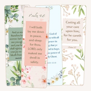 May include: Three floral bookmark designs with inspirational bible verses. The first bookmark is green with white flowers and the text "And ye now therefore have sorrow: but I see you again, and your heart shall rejoice, your joy no man taketh from you." John 16:22. The second bookmark is pink with white flowers and the text "Psalm 4:8 I will both lay me down in peace, and sleep: for thou, LORD, only makest me dwell in safety." The third bookmark is blue with white flowers and the text "Casting all your care upon him; for he careth for you." 1 Peter 5:7.