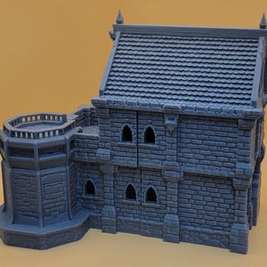 May include: A gray, 3D-printed miniature building featuring a two-story stone structure with a tiled roof, a side tower with a balcony, and multiple arched window openings. The model displays detailed brickwork textures across the exterior walls.
