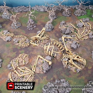 May include: A set of 3D printed, bone-coloured dragon skeleton pieces for tabletop gaming. The pieces are arranged on a green and brown surface, resembling a forest floor. The pieces are made of a textured, resin-like material. The text "PRINTABLE SCENERY" is visible in the lower left corner of the image. The text "www.printablescenery.com" is visible in the lower right corner of the image.