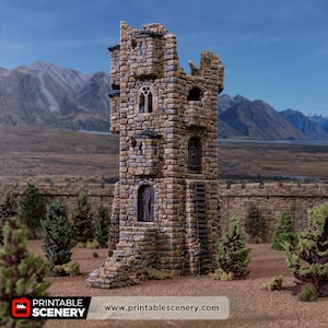 May include: A detailed model of a stone tower with a weathered appearance. The tower has arched windows and a wooden door, with a stone staircase leading up to it. The background features a landscape with mountains and trees. The text "PRINTABLE SCENERY" and website address are visible.