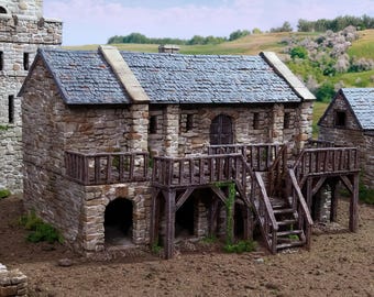 May include: A stone building with a wooden balcony and stairs. The building has a slate roof and is surrounded by a dirt yard.