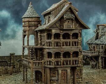 May include: A detailed model of a wooden building with a tower, multiple balconies, and a door. The building is painted in shades of brown and grey, and it has a weathered look. The model is made of paper and is designed to be printed and assembled.