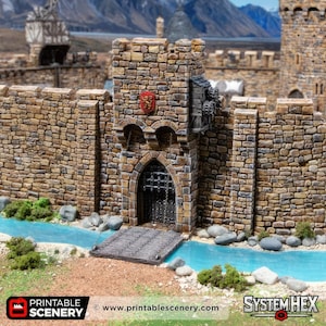 May include: A detailed model of a castle gatehouse with stone walls, a drawbridge, and a water feature. The gate features a portcullis and a coat of arms. The scene is set against a backdrop of mountains and a blue sky. The model is designed for tabletop gaming.